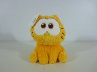 Lote conformado por: 40 Pzas aprox Osos de Peluche en Varios Colores y Peluche Garfield