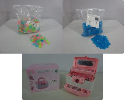 Lote conformado por: 107 Pzas aprox de bienes diversos como: Maletines de Maquillaje Infantil y Piedras para Pecera