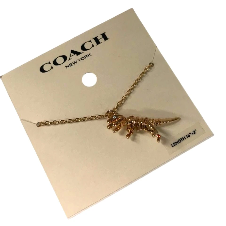 COLLAR COACH SKELETAL REXY – TONO DORADO NUEVO. — imagen 3